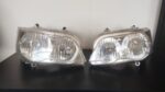 ACW2514230 - Farol lado esquerdo linha MF4000